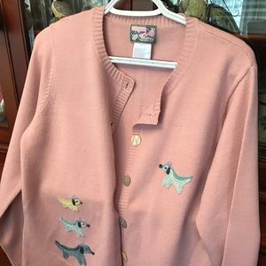 Super cute sweater has dogs embroidered on it